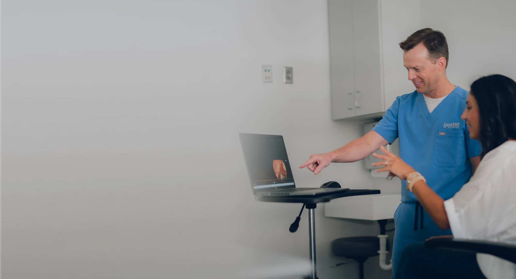 a man standing in front of a computer